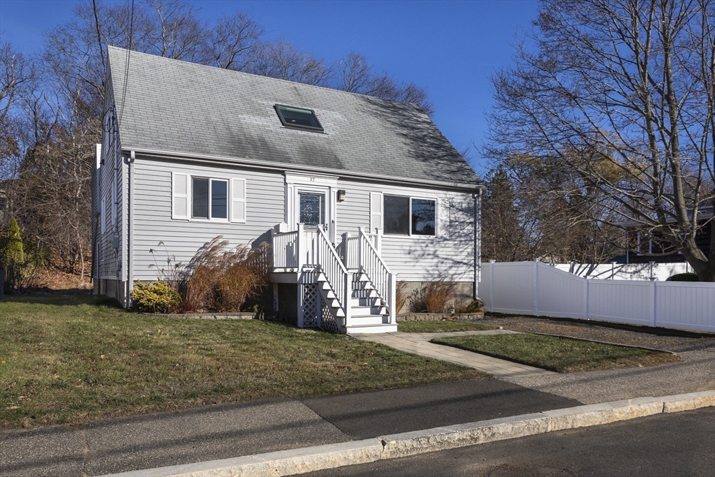 a front view of a house with a yard