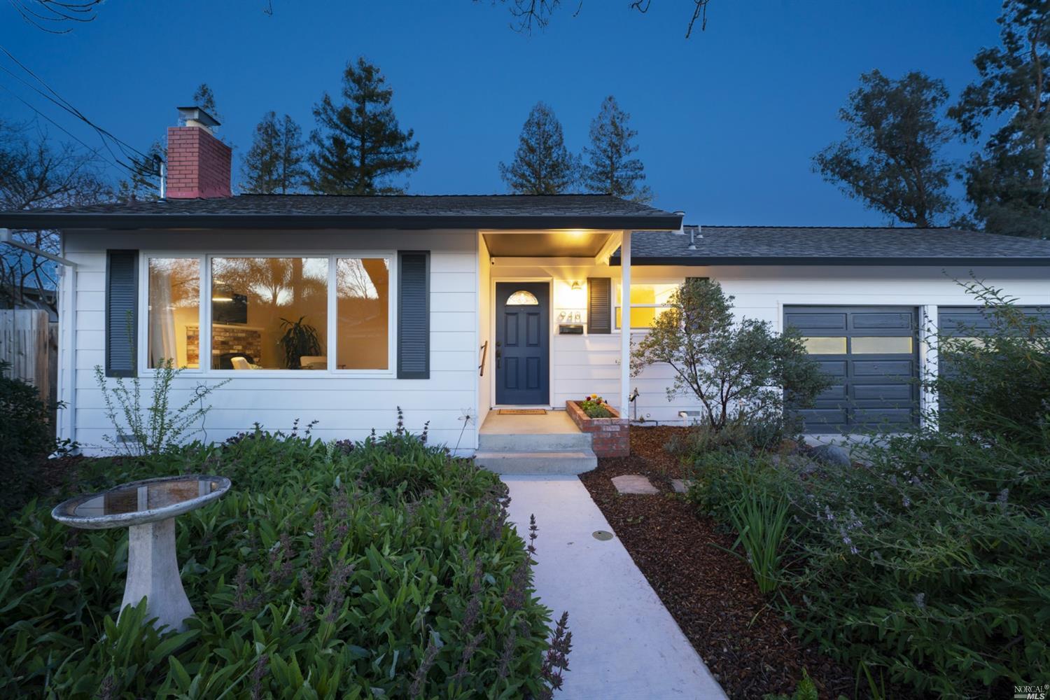 a front view of a house with garden