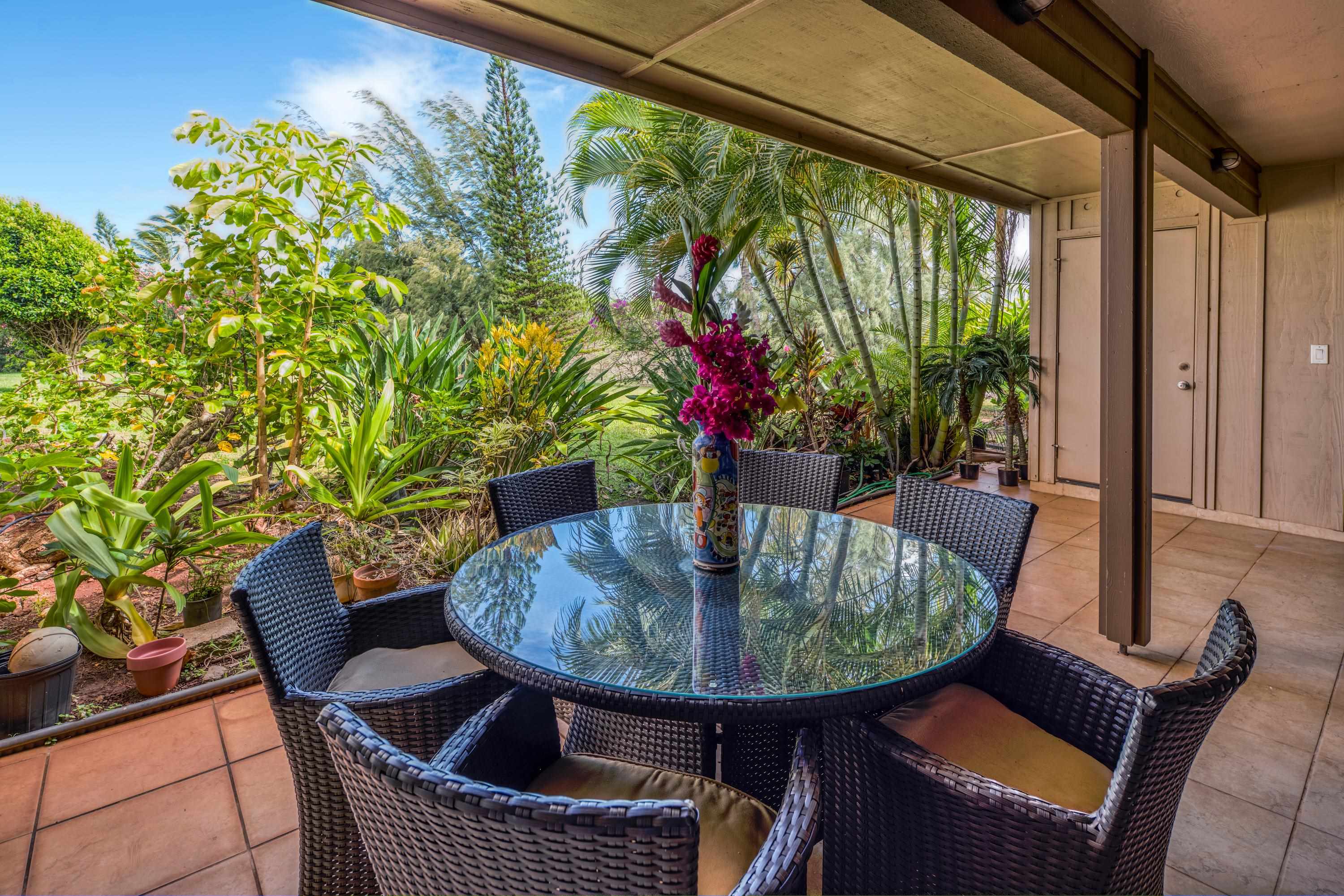 a view of balcony with furniture and a potted plant