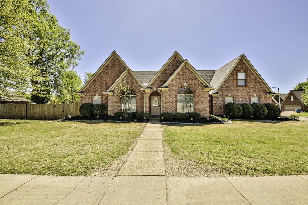 a front view of house with an outdoor space