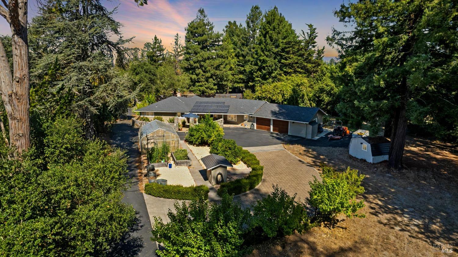 an aerial view of a house with yard swimming pool and outdoor seating