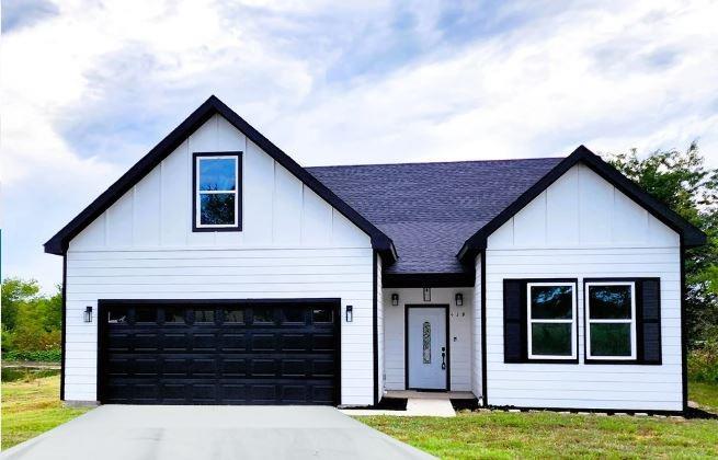 a front view of a house with a yard