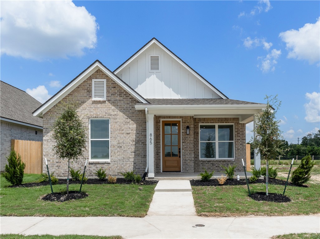 View of front of house with covered porch and a fr