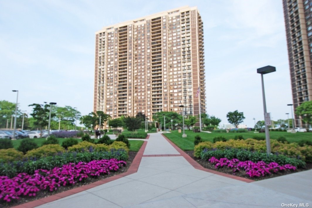 a view of flower garden in front of a building