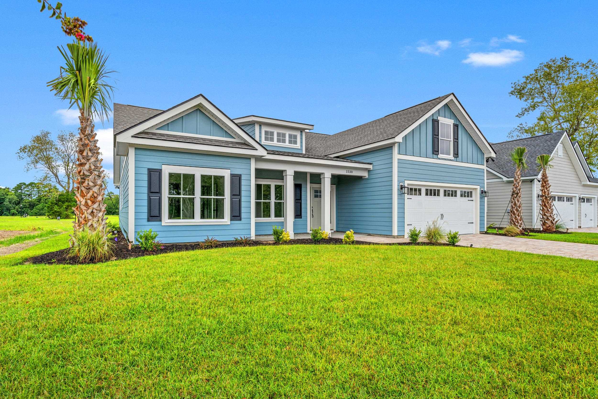 Craftsman inspired home with a garage and a front