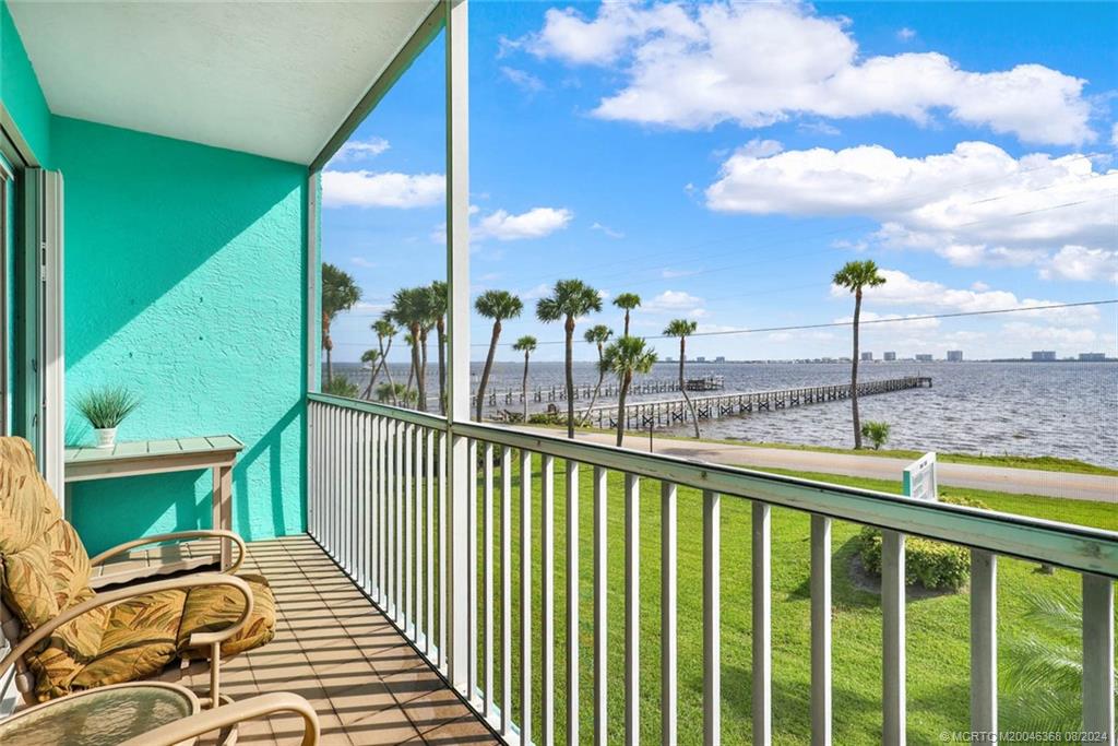 a view of a balcony with chairs