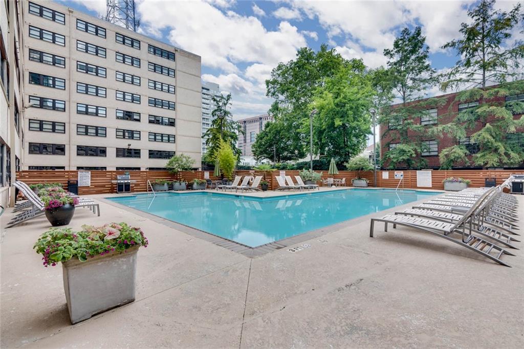 a view of a swimming pool with a lounge chair