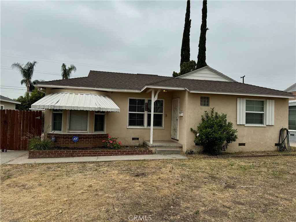 a front view of a house with yard