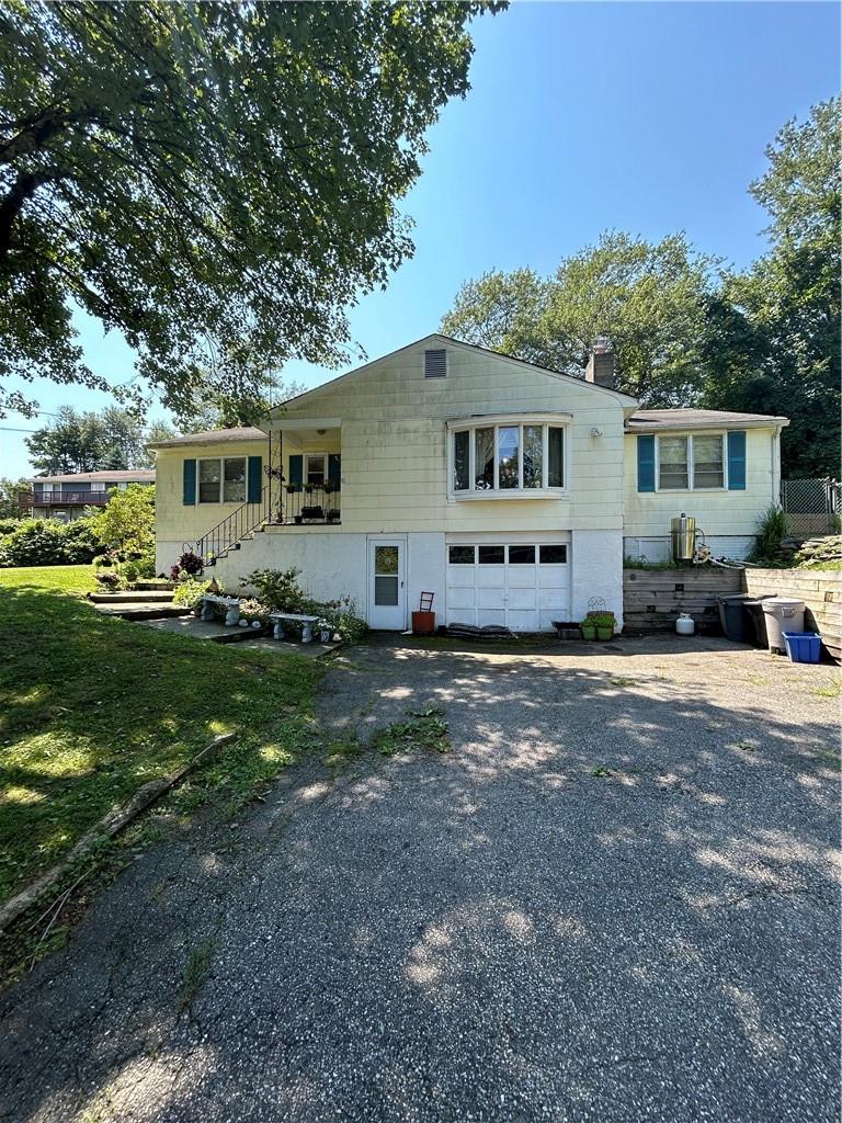 View of front of home featuring a garage