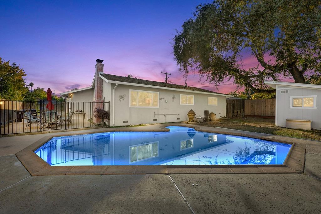 a view of swimming pool with outdoor seating