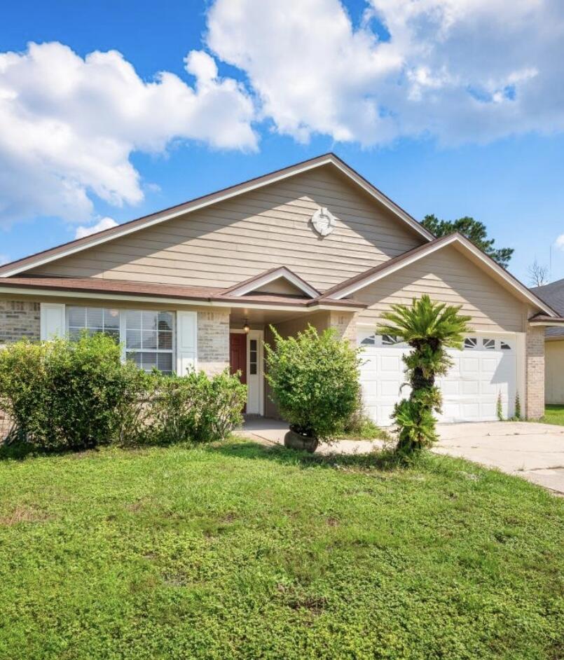 front view of a house with a yard