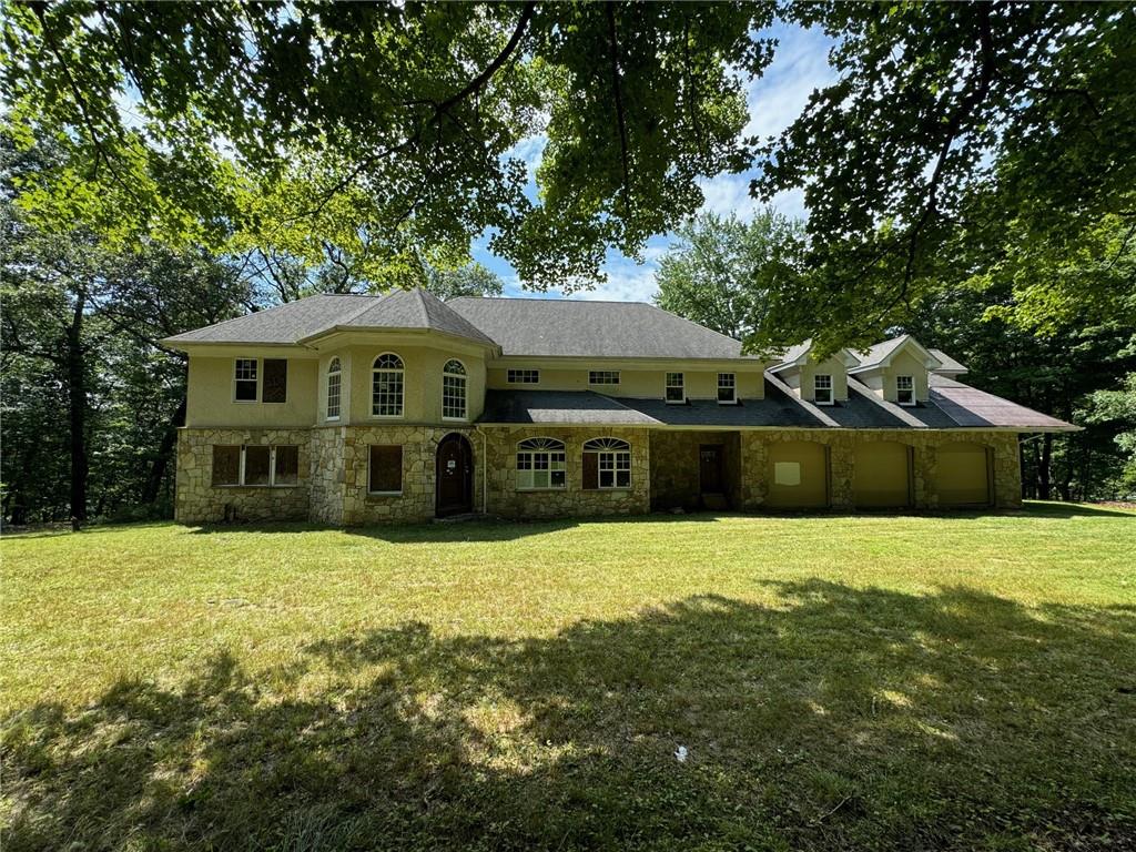 a front view of a house with a yard