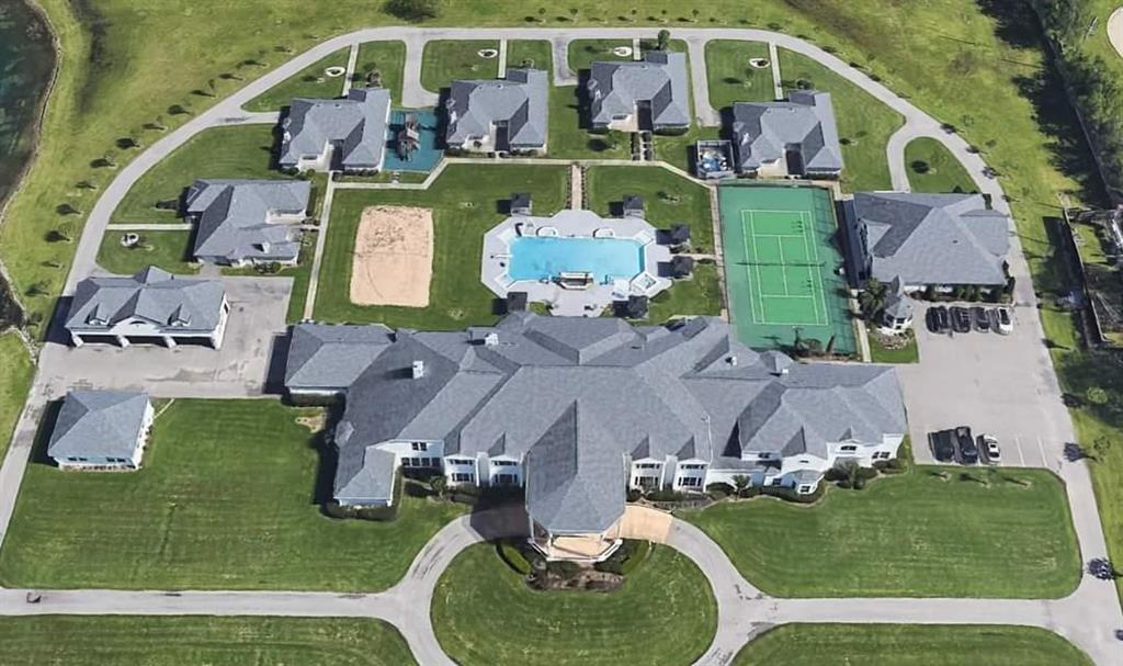 an aerial view of a house with outdoor space patio and swimming pool