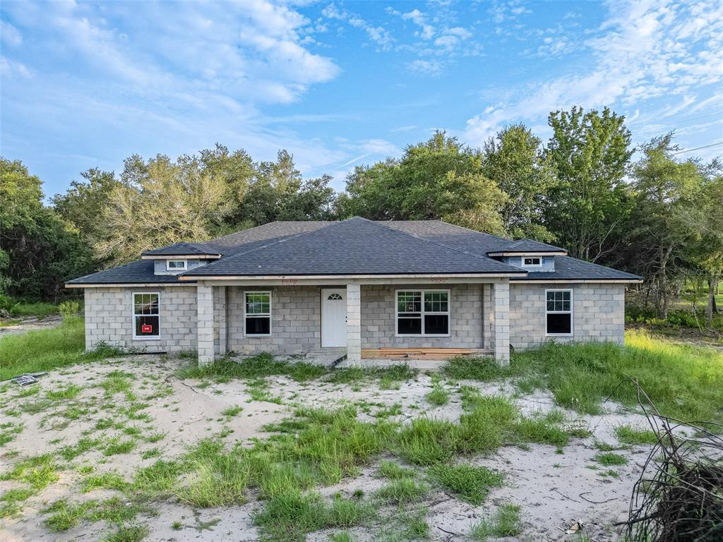 a house with trees in the background