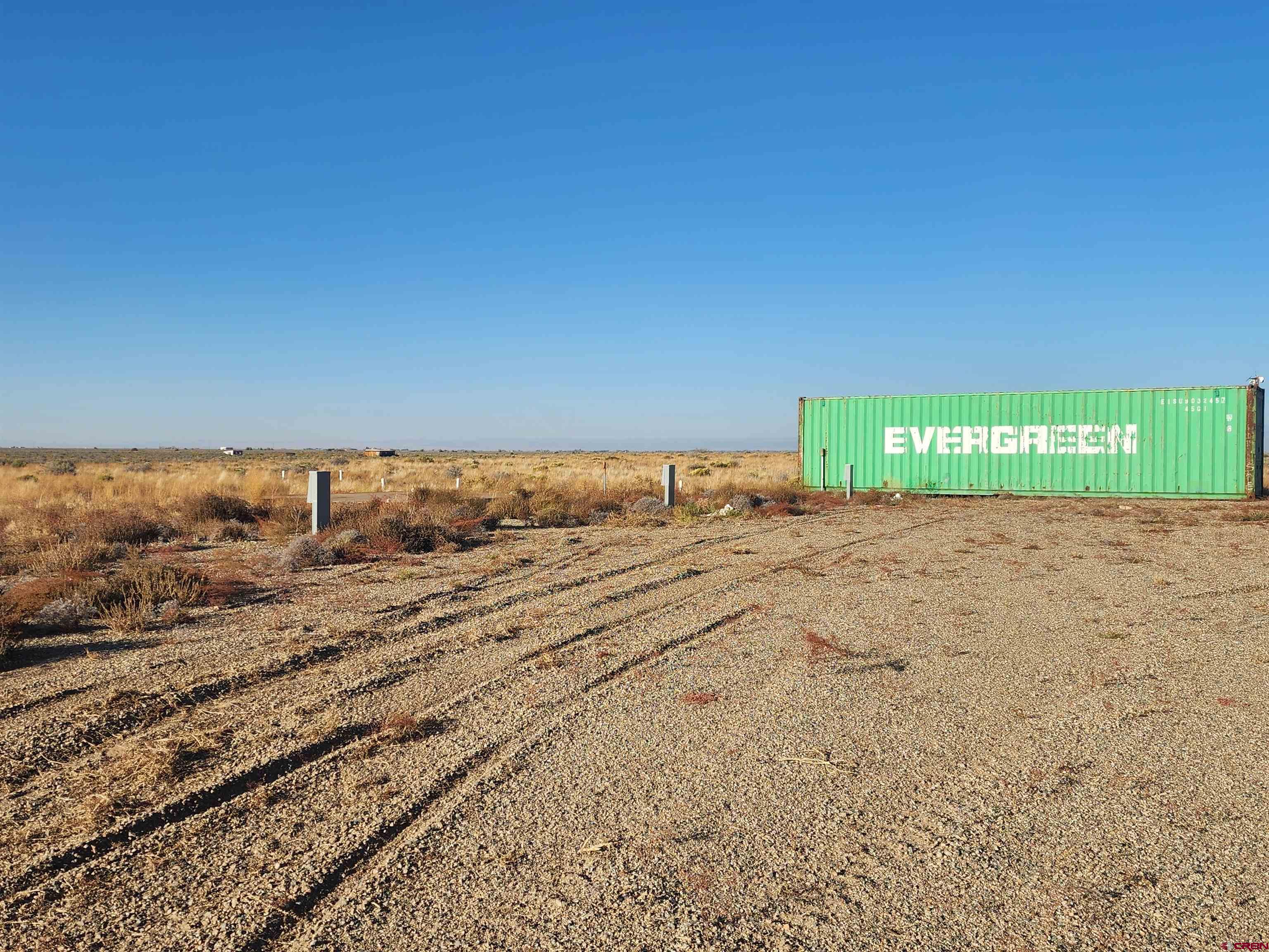 a view of a road with a building in the background