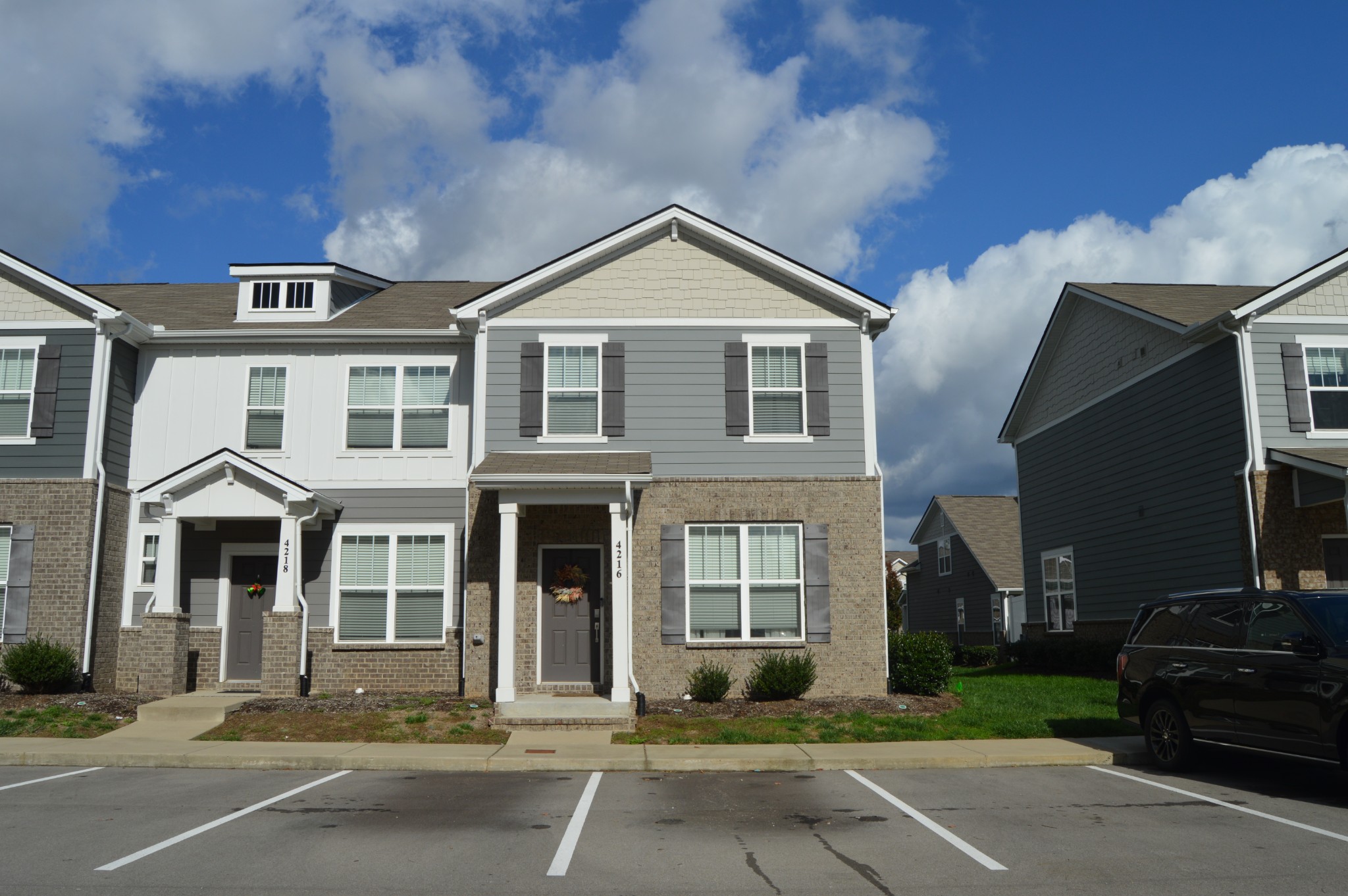 a front view of a house with a yard