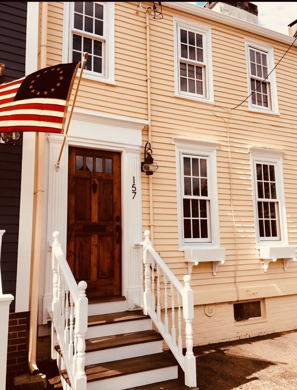 a front view of a house with a porch