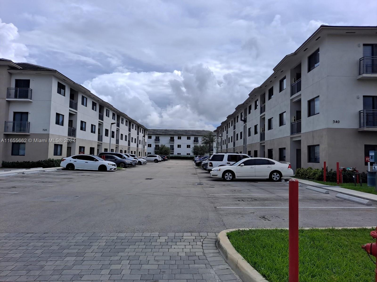 a view of a street with cars