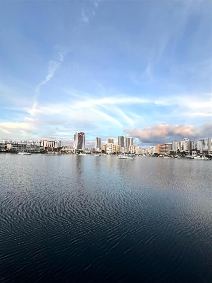 a view of an ocean with city