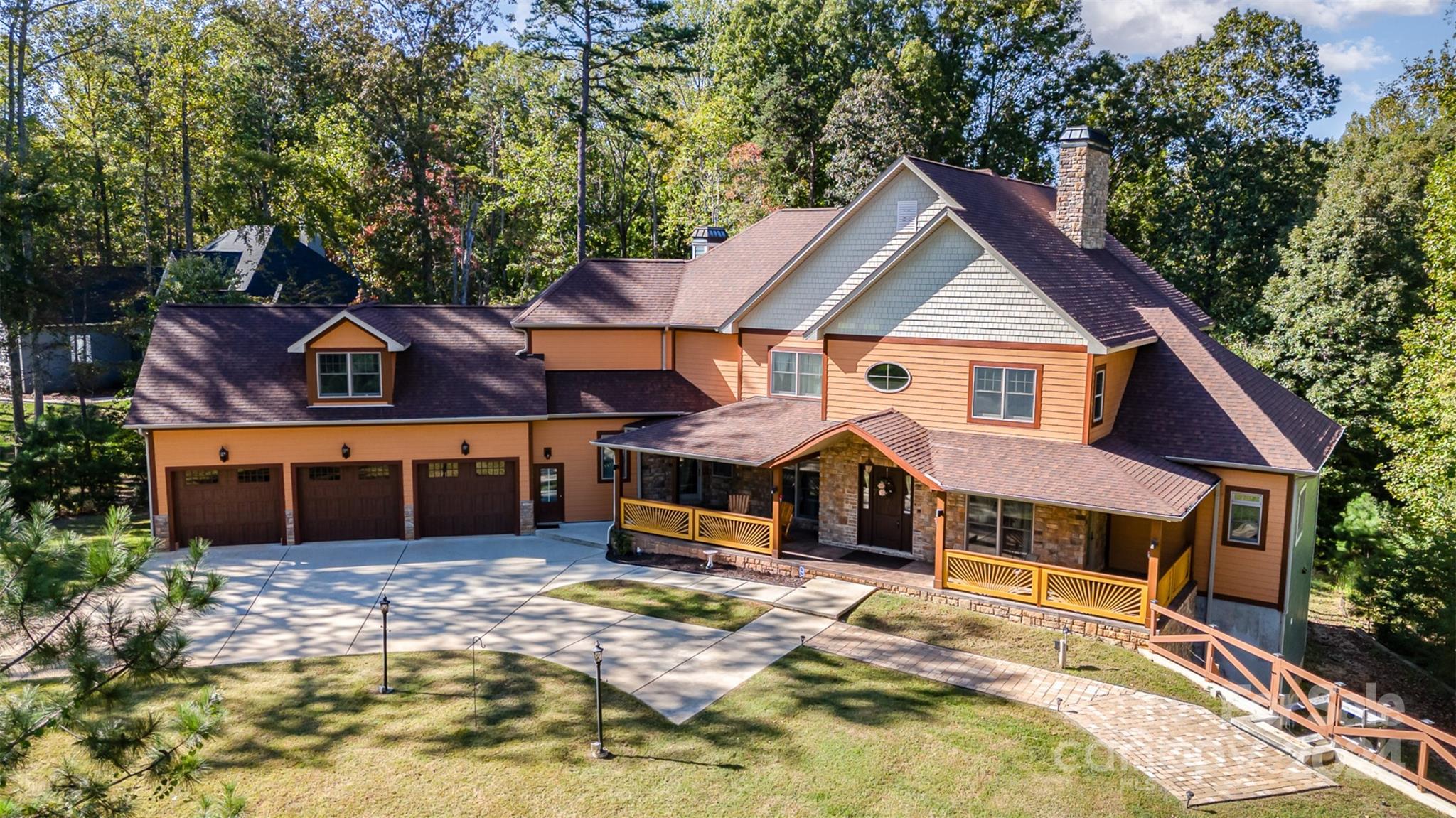 a front view of a house with a yard outdoor seating and yard in the back