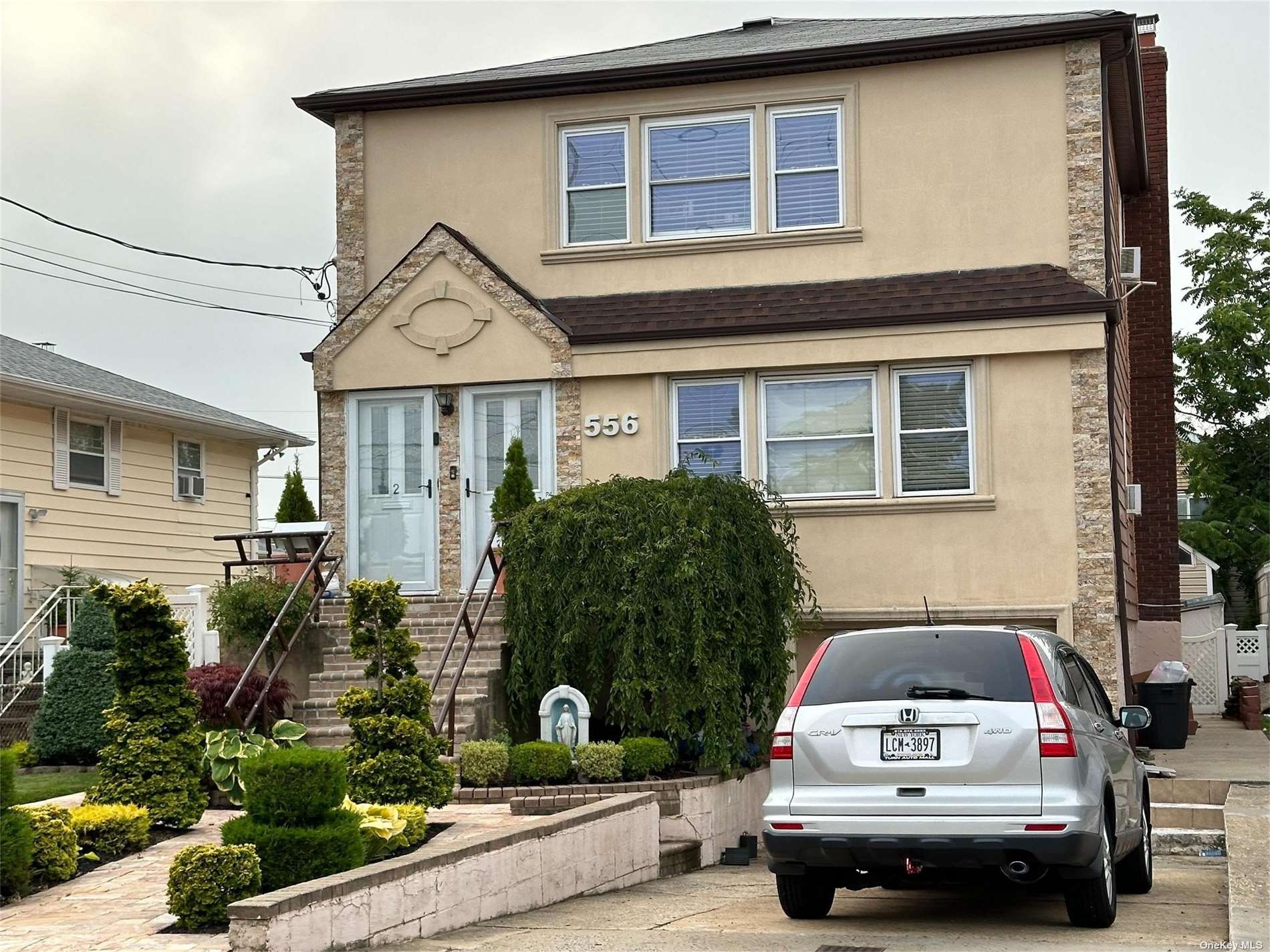 a car parked in front of a house