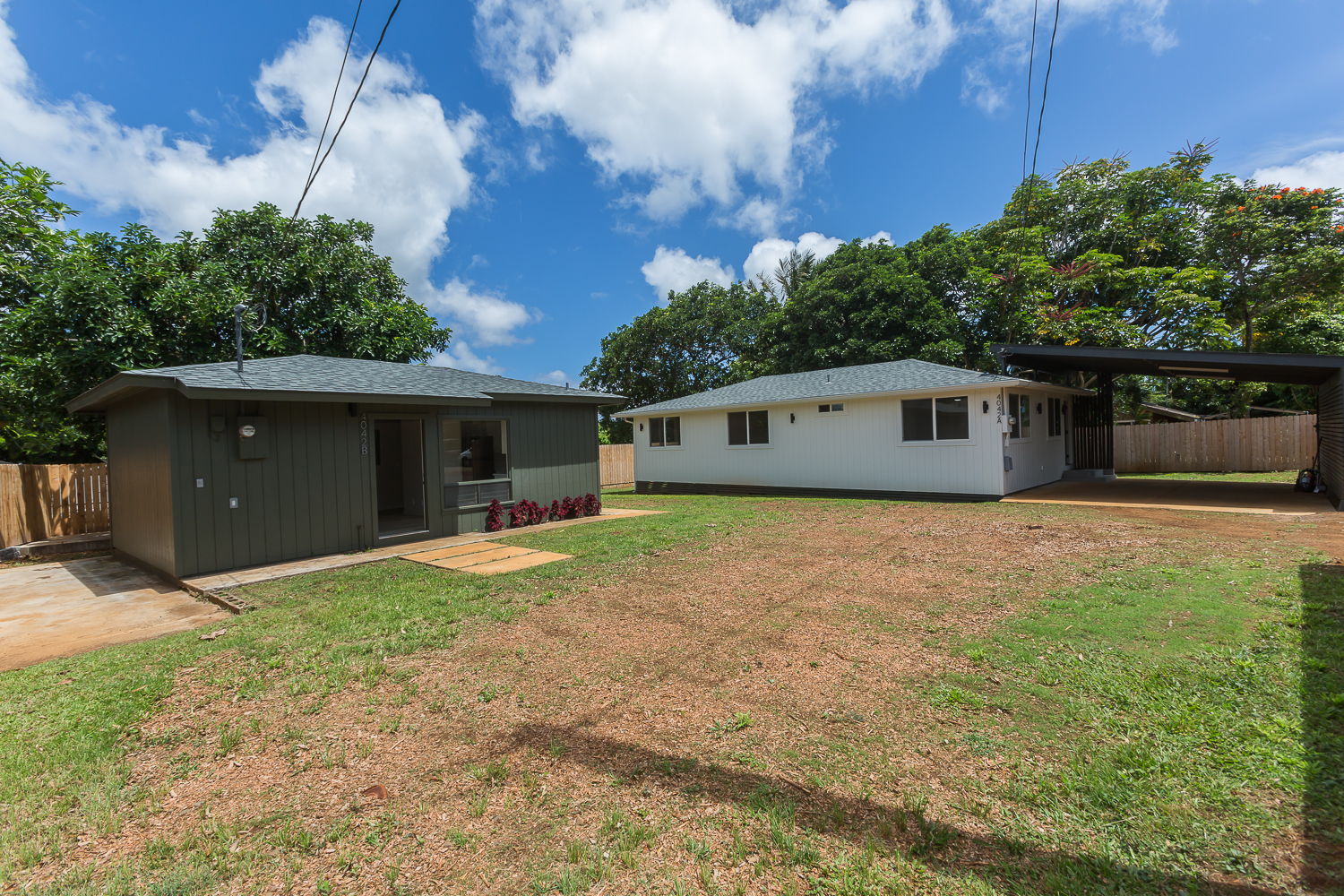 a front view of a house with a yard and a garage