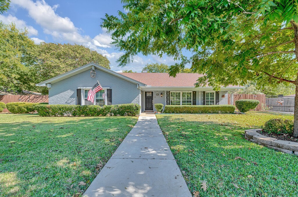 a front view of a house with yard