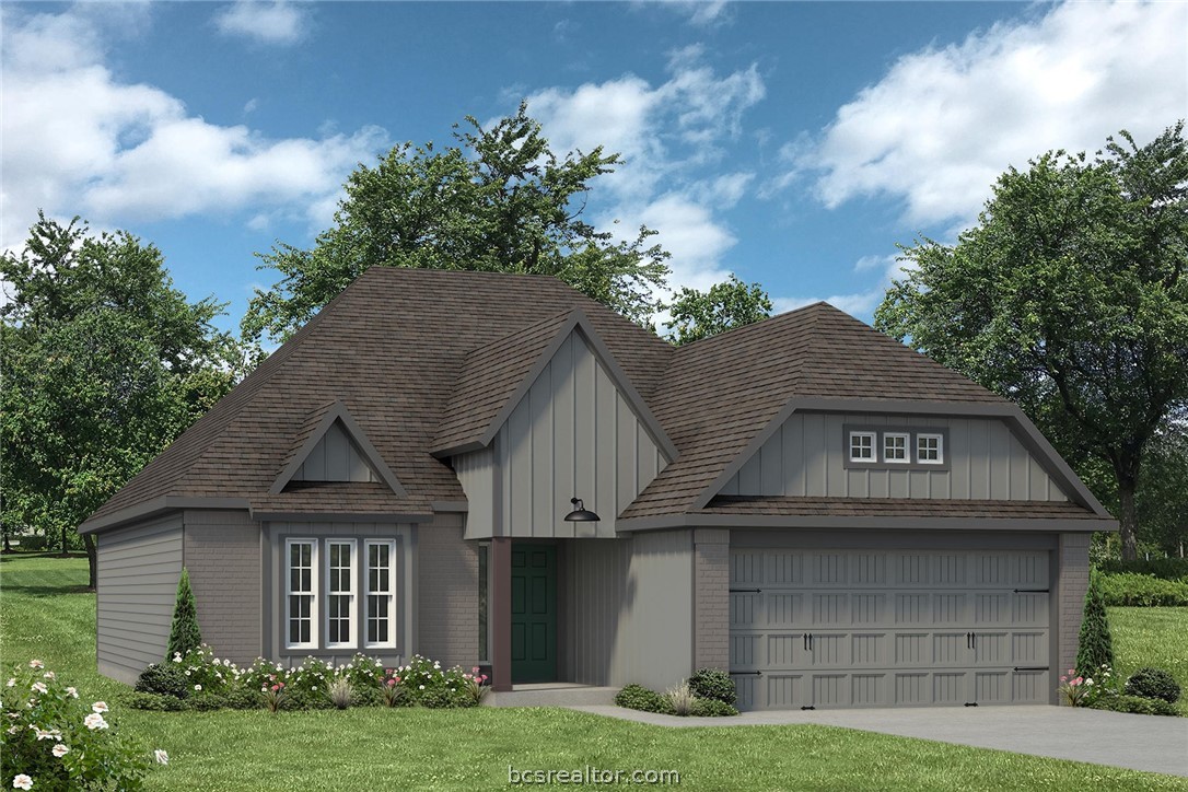 a view of a house with a yard and garage