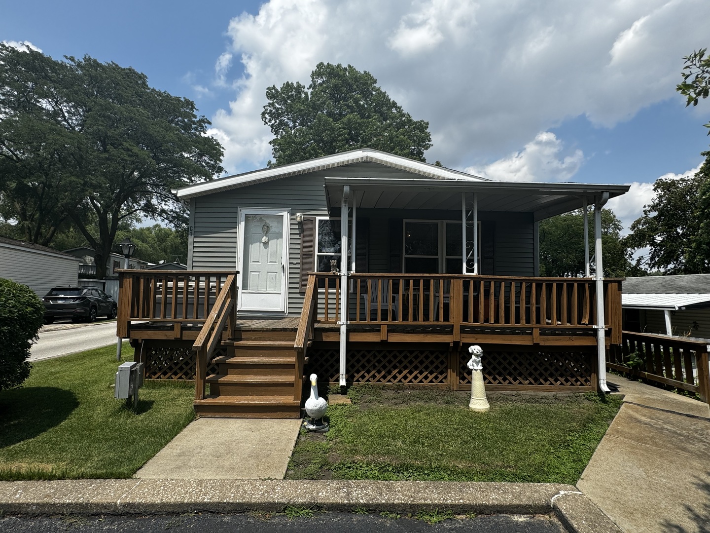 a view of a deck with a yard