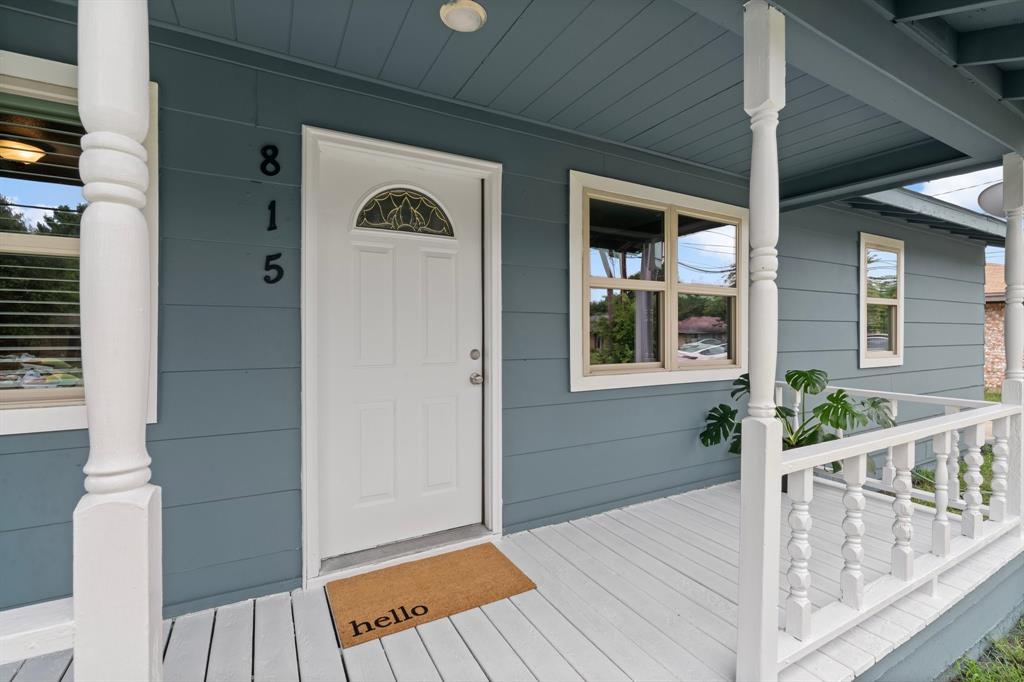 a view of a house with wooden floor and wooden fence