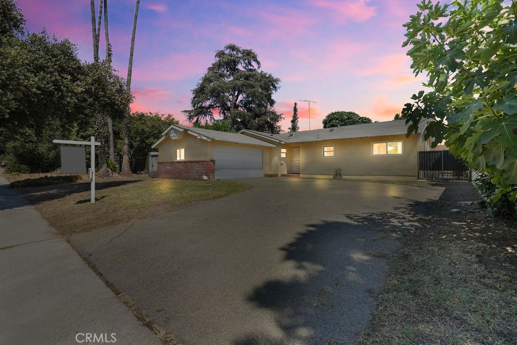 a view of a street in front of a house