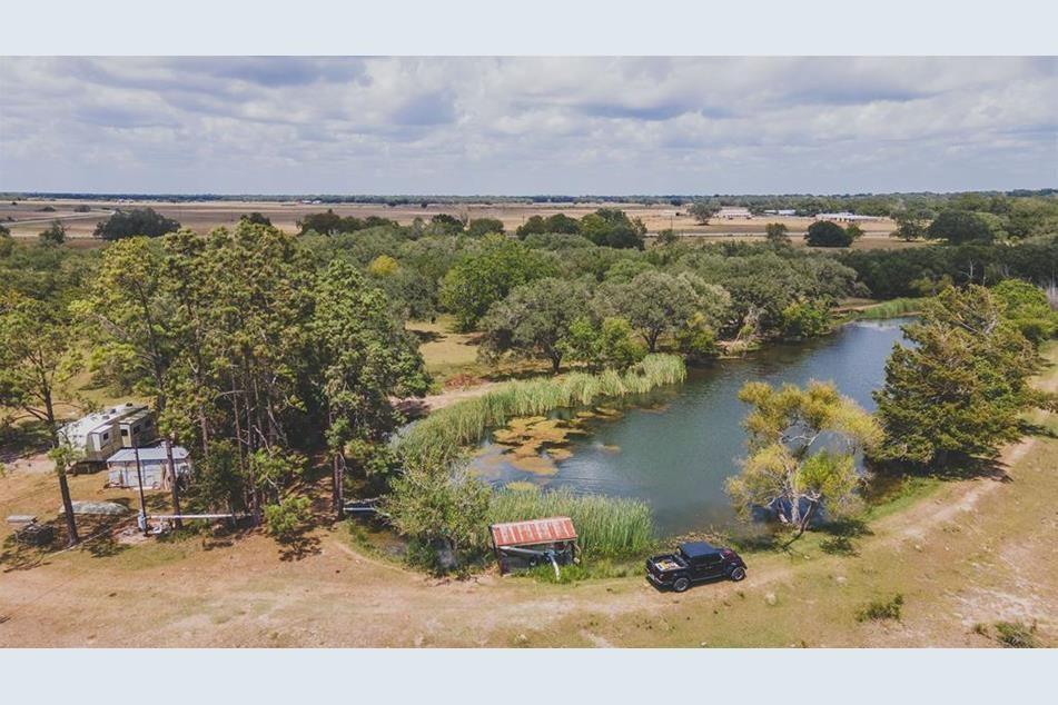 an aerial view of a houses with outdoor space