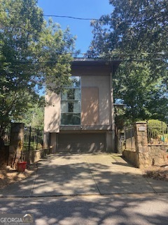 a view of a water fountain in front of a house