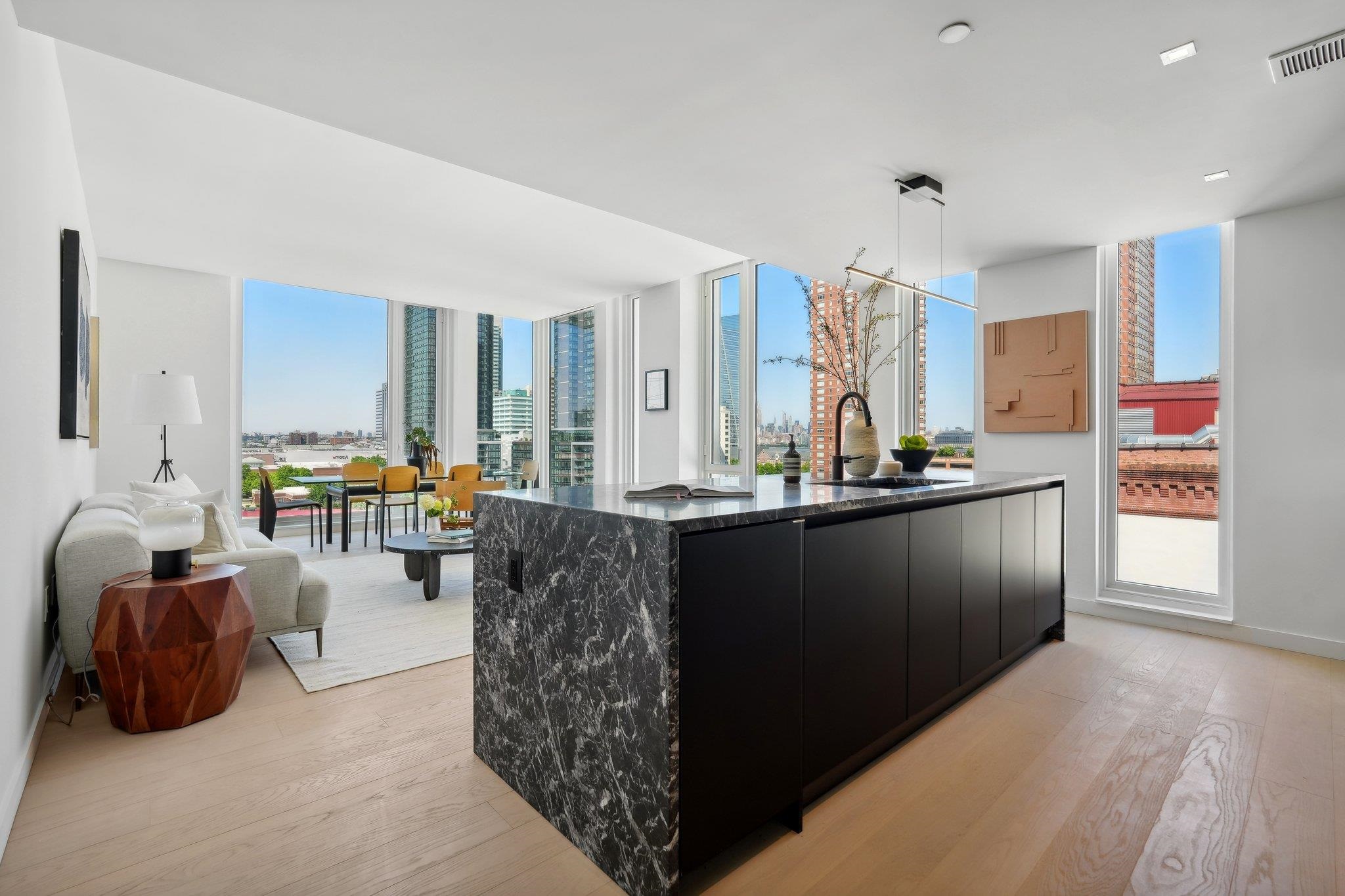 a kitchen with granite countertop a refrigerator and a sink