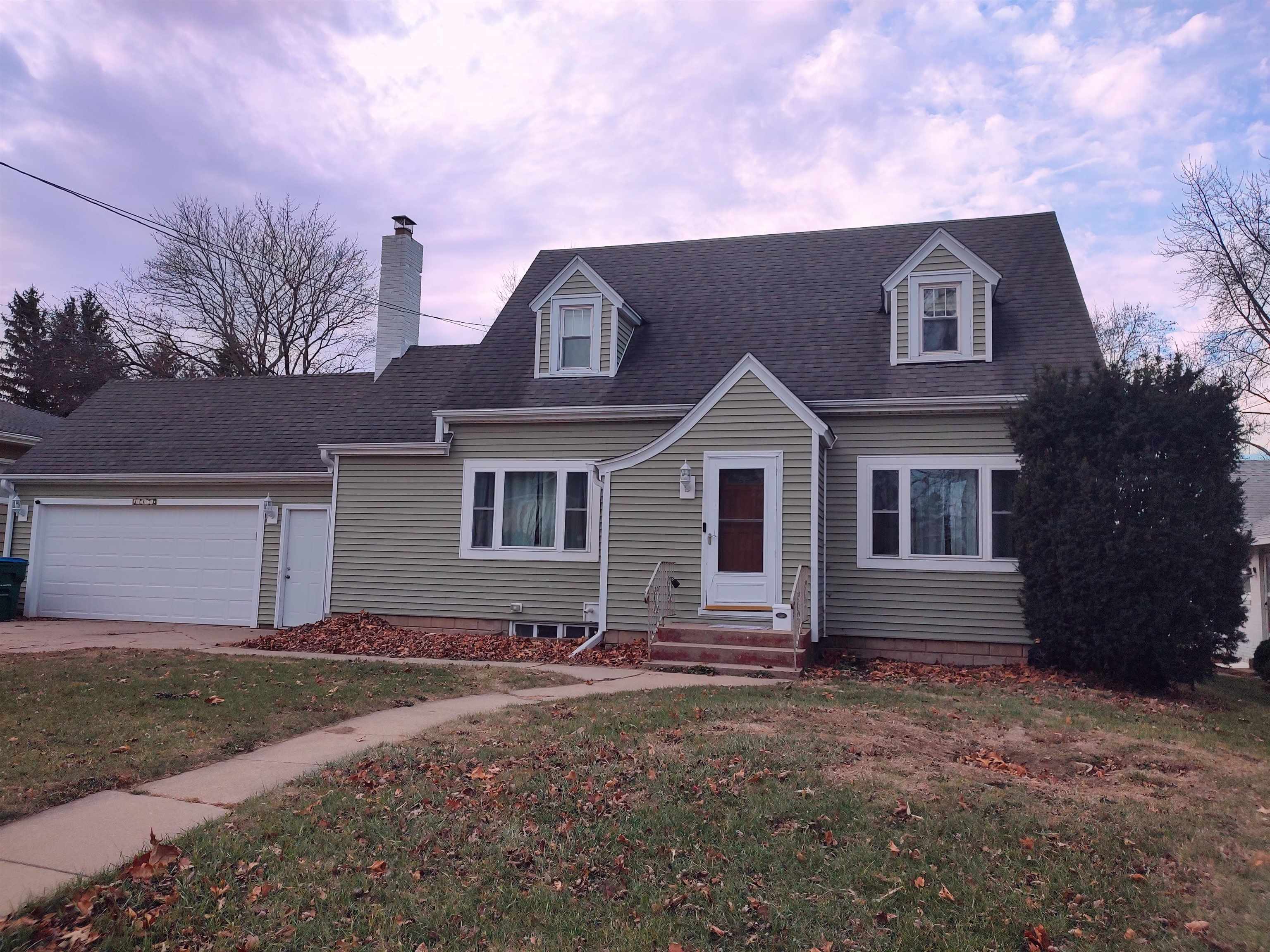 a front view of a house with yard