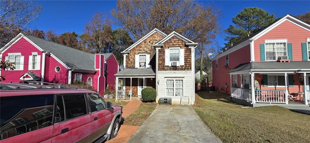 a view of a house with a yard