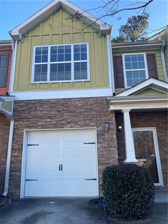 a front view of a house with a garage