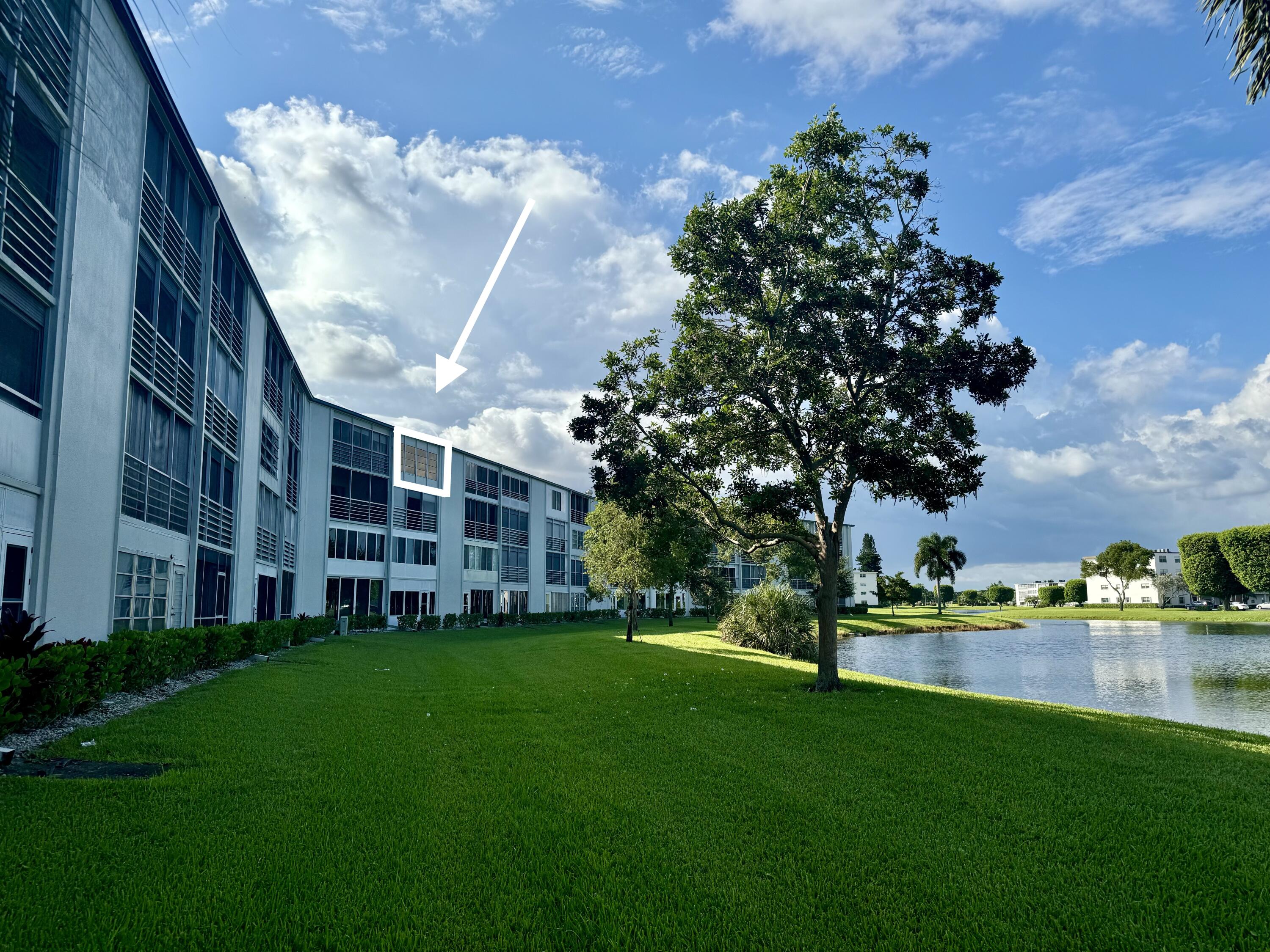 a view of a building with a yard