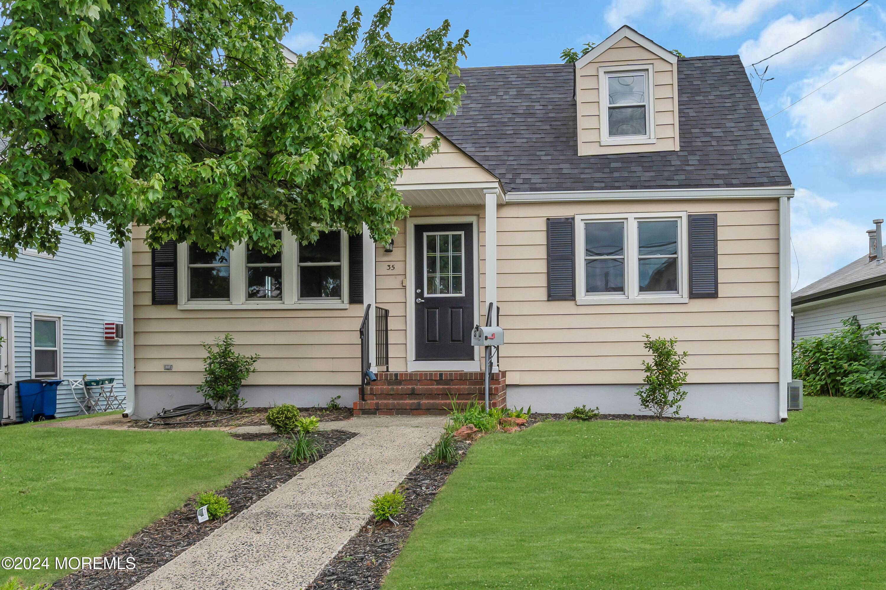 a front view of a house with a yard