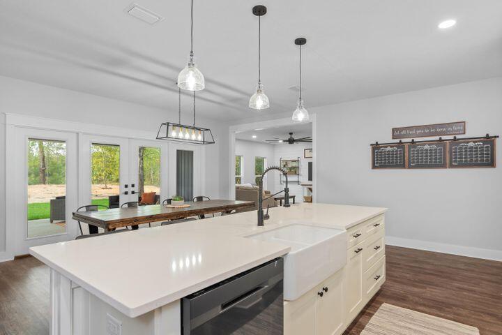 a large kitchen with kitchen island a sink appliances and a center island