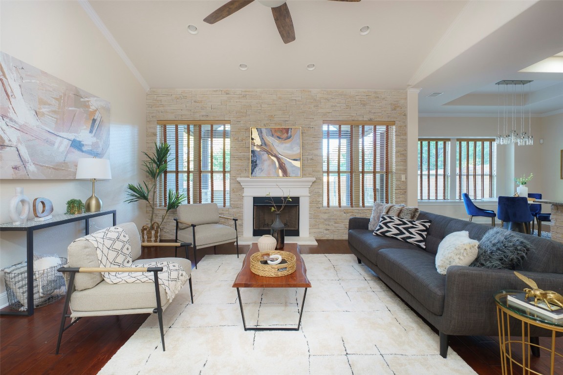 a living room with furniture and a fireplace