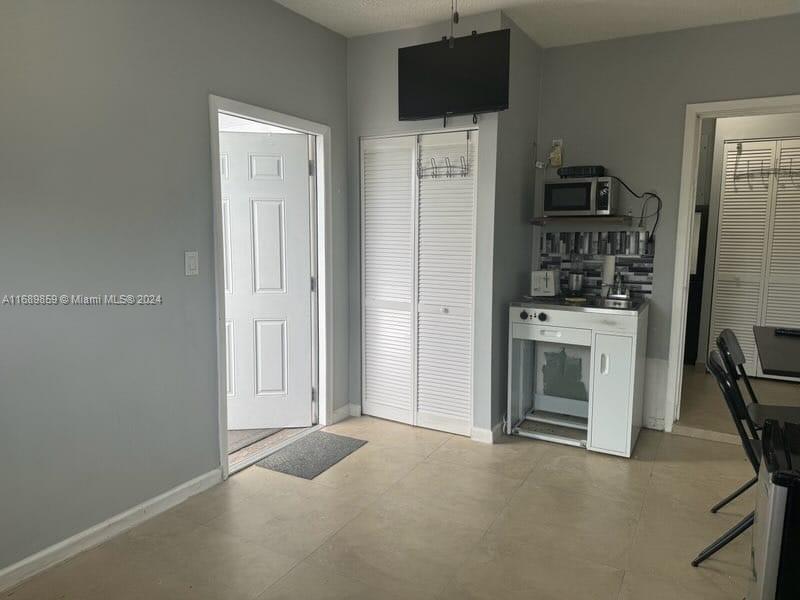 a view of a livingroom with furniture and a flat screen tv