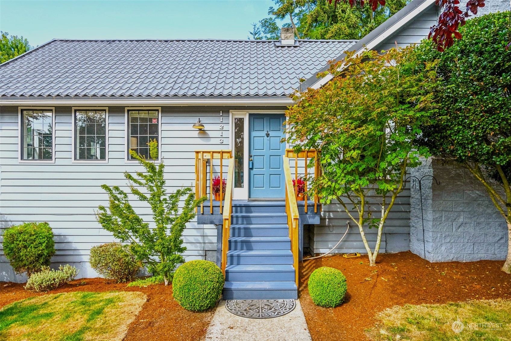 a front view of a house with garden