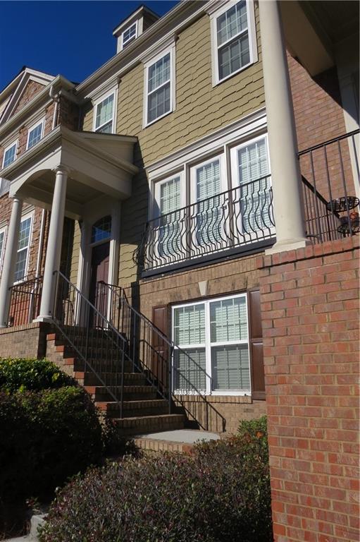 a view of a house with a window and stairs