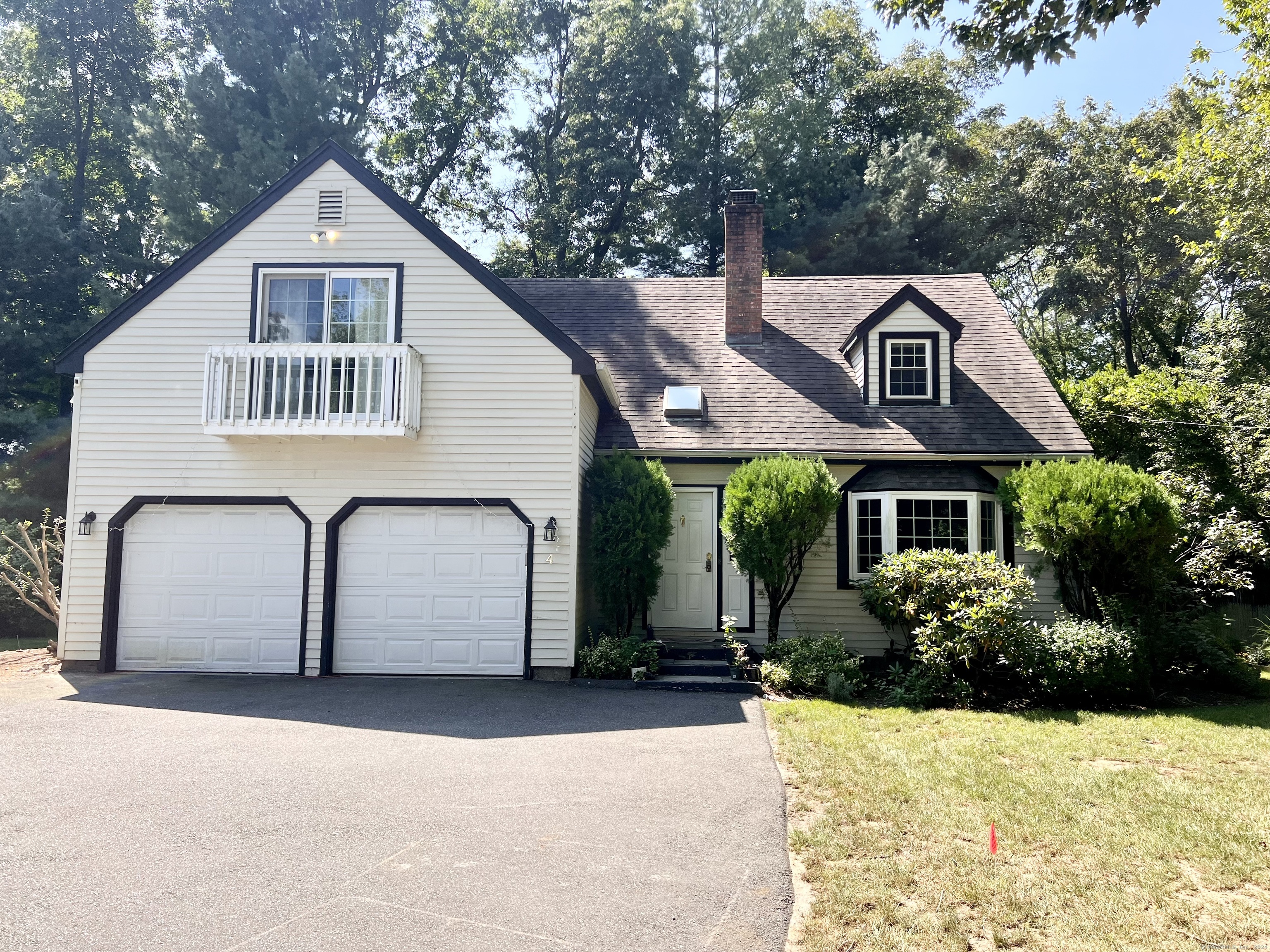 a front view of a house with a yard garage and garage