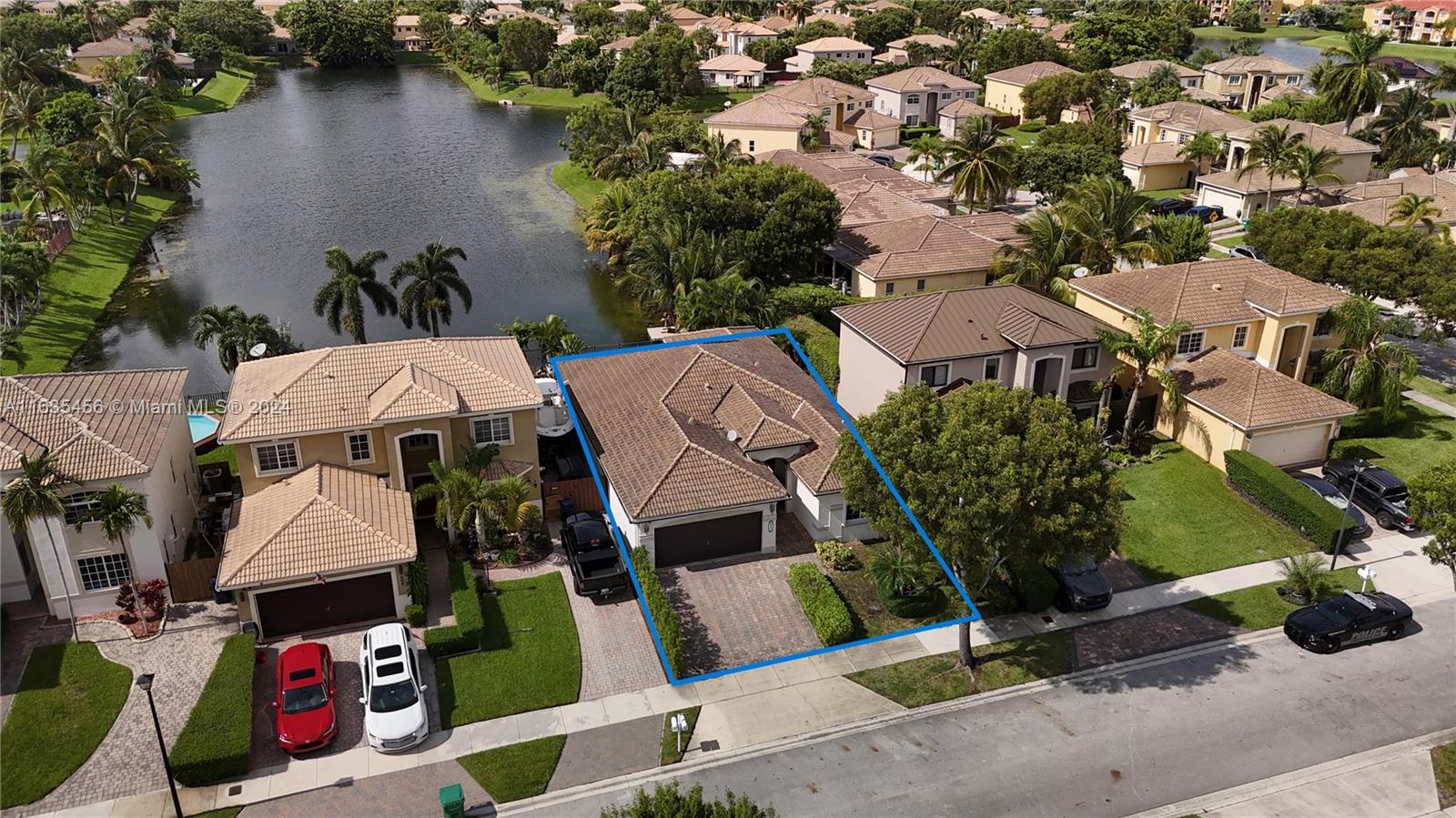 an aerial view of multiple houses with yard