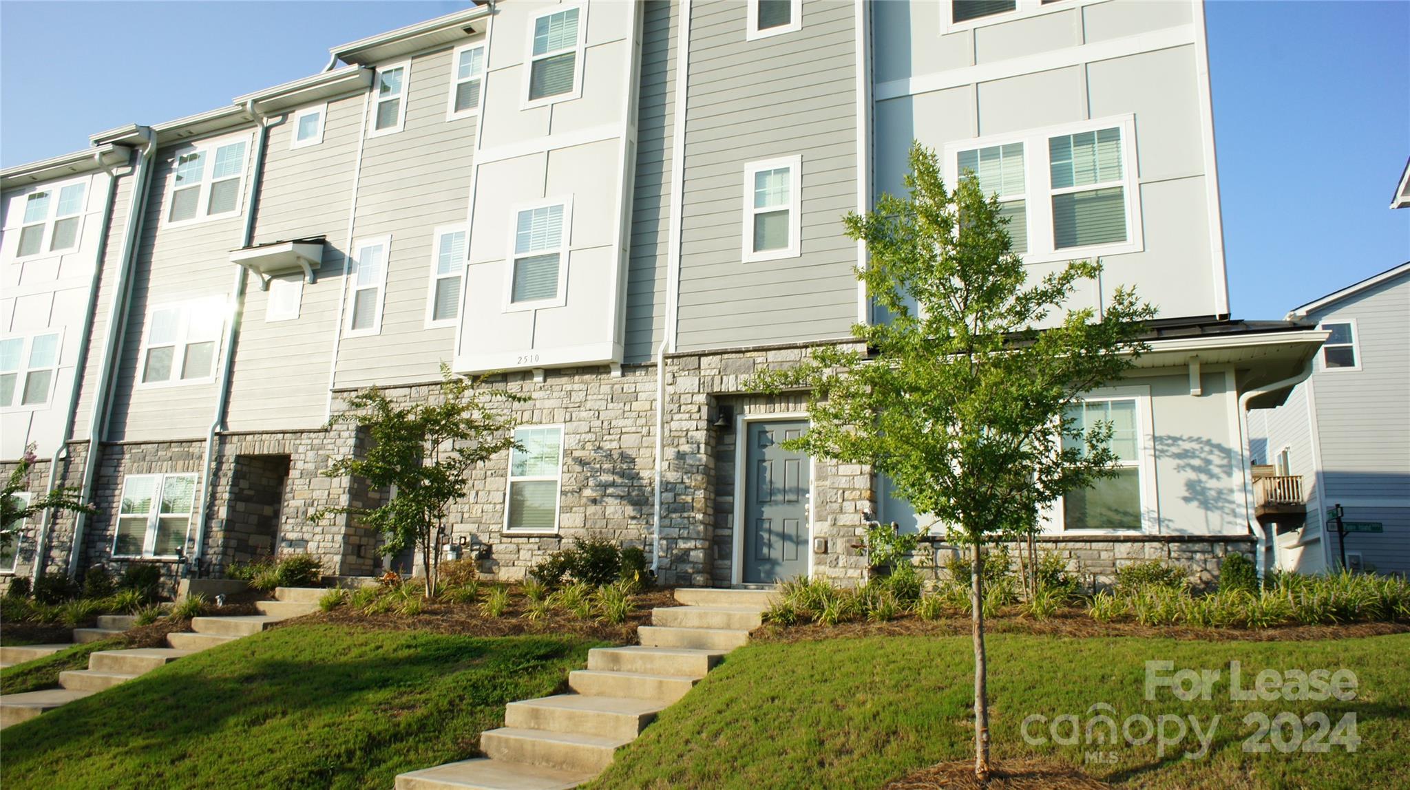 front view of a building with a yard