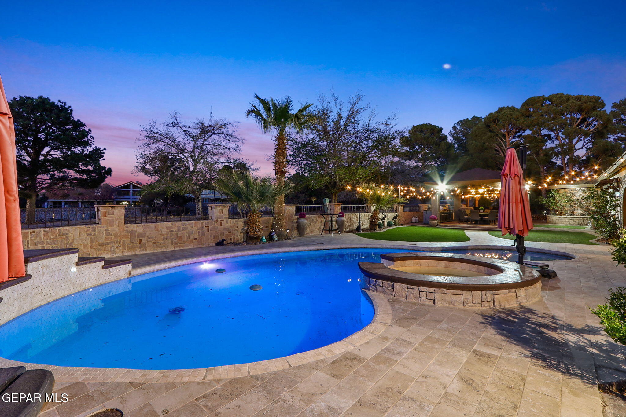 a view of a swimming pool with an outdoor space and seating area