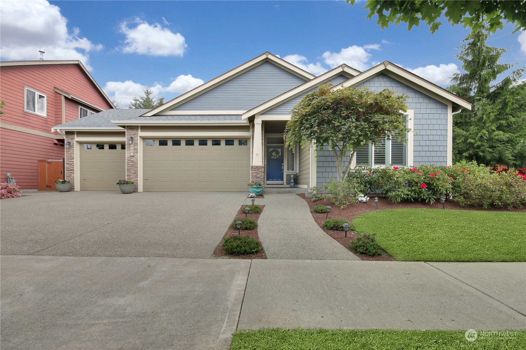 a front view of house with yard and green space