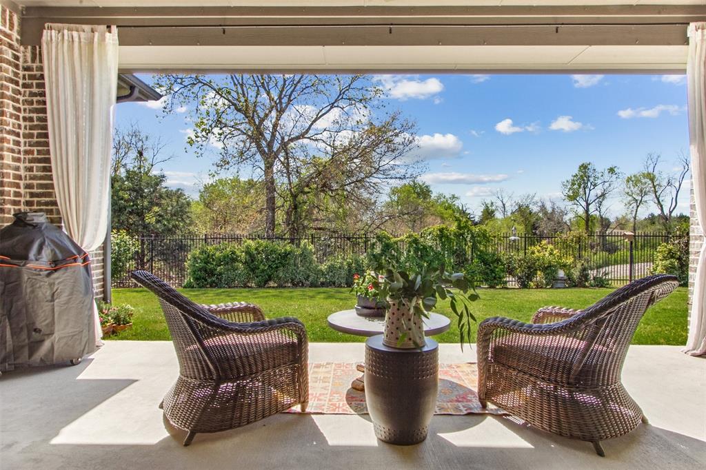 a view of an outdoor sitting area with furniture